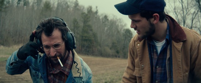 Leonard Shuler (Noah Wyle) and Travis Shelton (Jeremy Irvine) go metal detecting for Civil War artifacts on an old North Carolina battleground in "The World Made Straight."