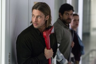 Gerry (Brad Pitt) wields a hatchet against hordes of zombies he expects to encounter.