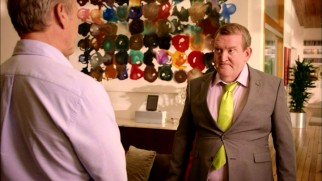 Alan (Nigel Betts) doesn't realize he's a fat guy in a little coat.
