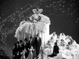 Men in top hats, women in endless dresses, revolving stages, and no shortage of fanfare... it's the Ziegfeld Follies!