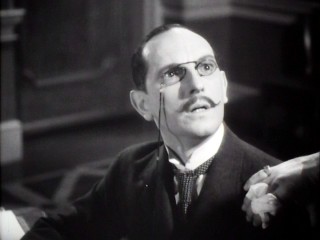 Captain Alfred Dreyfus (Joseph Schildkraut) is shocked to hear himself accused of high treason.