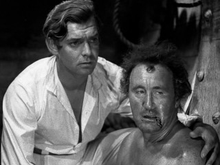 Out of necessity, Lieutenant Fletcher Christian (a clean-shaven Clark Gable) becomes the man to stand up for the excessively-disciplined sailors (like Donald Crisp's Burkitt) aboard The Bounty.