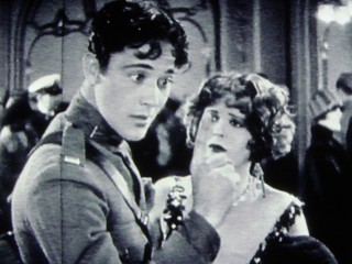 Unfortunately for Mary (Clara Bow), even a sparkly dress can't pull David's (Richard Arlen) attentions away from the animated bubbles he sees emanating from his finger and other things.