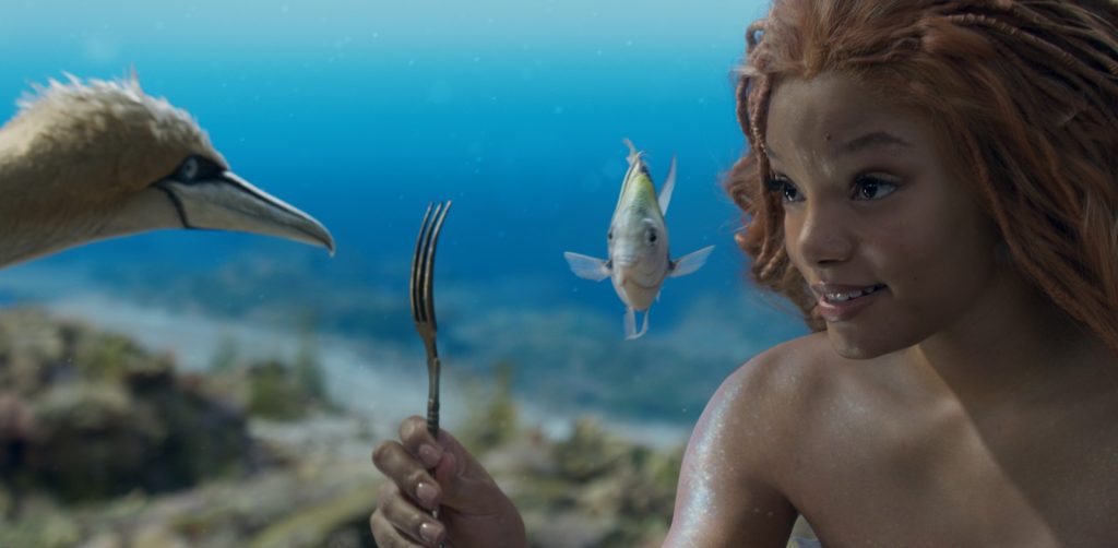 Ariel (Halle Bailey) consults Scuttle regarding her new find from the human world in Disney's 2023 remake "The Little Mermaid."