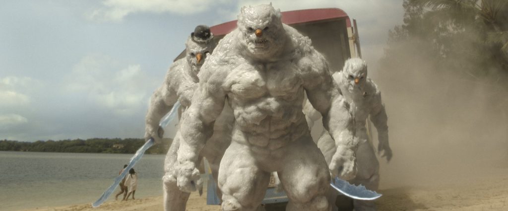Blade-wielding killer snowmen drive up to an Aruba beach in an ice cream truck in "Red One."