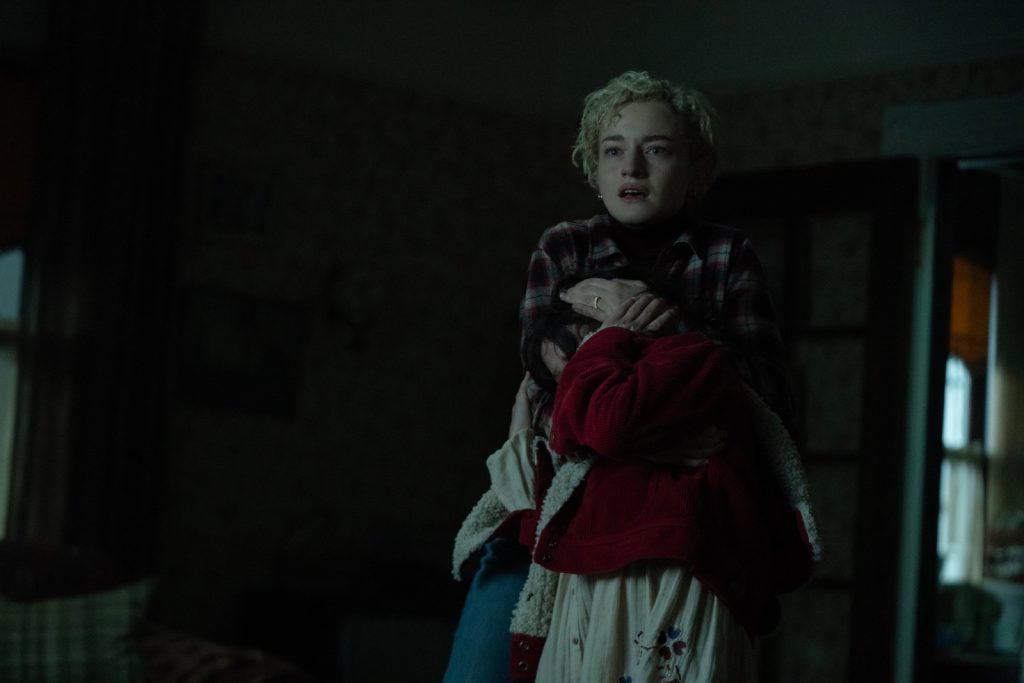 An unlikely workaholic journalist (Julia Garner) shields her daughter's ears and eyes from the horror that is "Wolf Man."